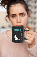 Coffee mug with cat design and words "Not my fault"