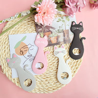 Cute bottle openers shaped like cats in four different colors- black, white, pink, and gray. Perfect gift idea for cat lovers