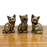 Different brass cat figurines