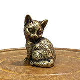 Small brass statue of sitting cat