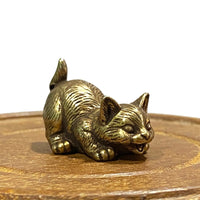 Brass cat figurine of a kitten ready to pounce