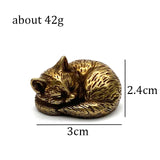 Sleepy cat brass figurine